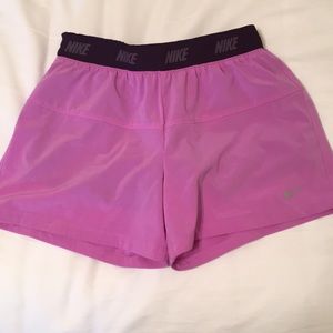 Purple Nike Dri-Fit shorts